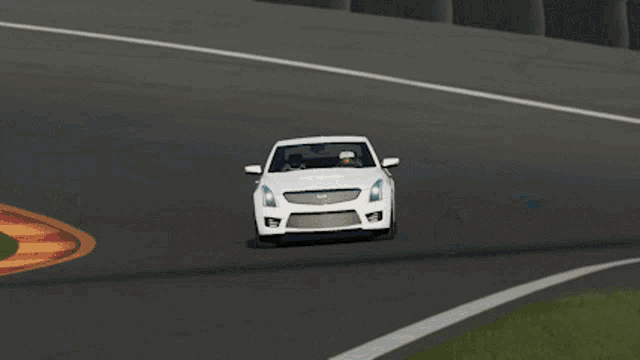 a white cadillac is driving down a road