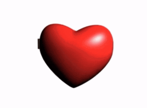 a heart shaped mirror with a picture of a man on it