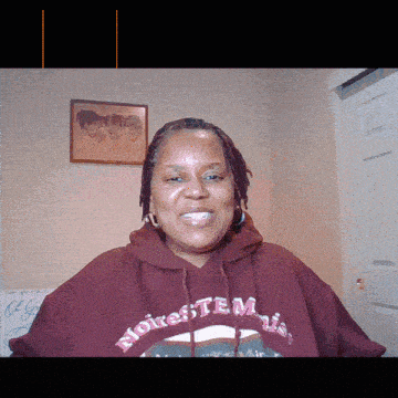 a woman wearing a hoodie that says " noire "