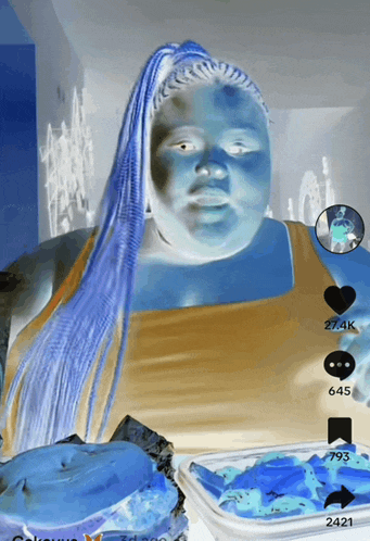 a drawing of a woman with blue hair and a container of blue icing