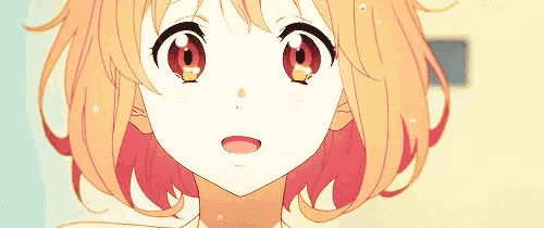 a close up of a girl 's face with red eyes and orange hair