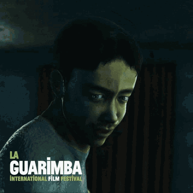 a poster for the la guarimba international film festival shows a man 's face