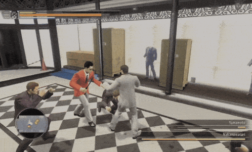 a man in a red jacket is fighting another man in a game