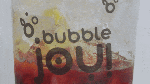 a close up of a cup of bubble joui