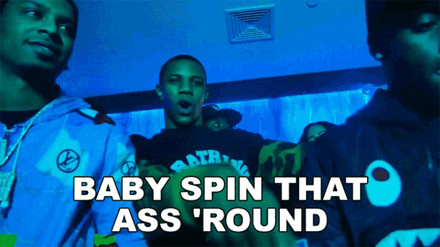 a group of men are standing in a room with the words baby spin that ass round on the bottom