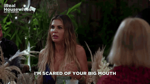 a woman says i 'm scared of your big mouth at a table