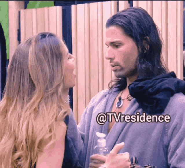 a man and a woman are looking at each other with the words @tvresidence below them