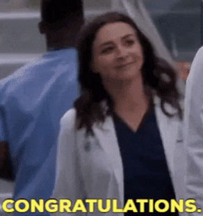 a woman in a lab coat is smiling and says congratulations