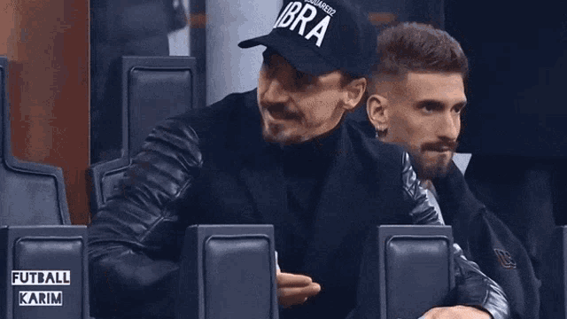 a man wearing a black hat that says ibra on it