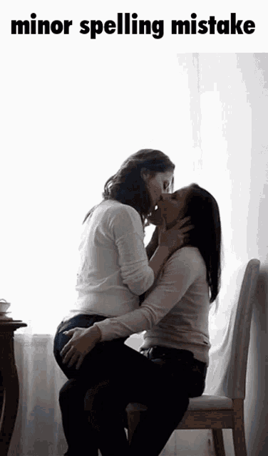 two women kissing with the words minor spelling mistake below