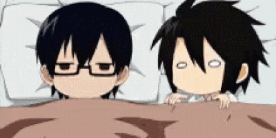 two anime characters are laying under a blanket and one has glasses on .