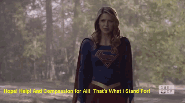 a woman in a superman costume says hope help and compassion for all that 's what i stand for !