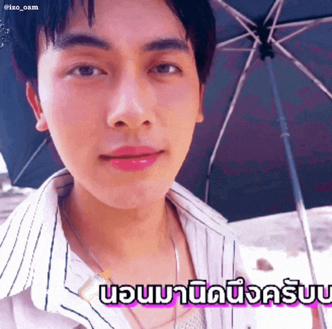 a close up of a man 's face with a striped shirt and a black umbrella