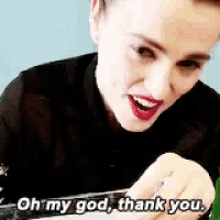 a woman is smiling and saying oh my god thank you