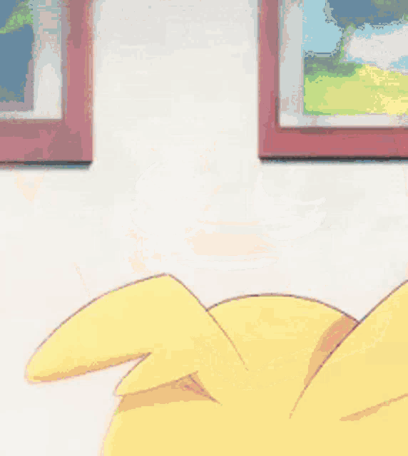 a close up of a cartoon character wearing a yellow hoodie and a red shirt .