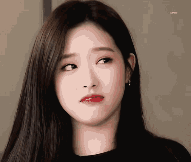 a close up of a woman 's face with a watermark that says kpop