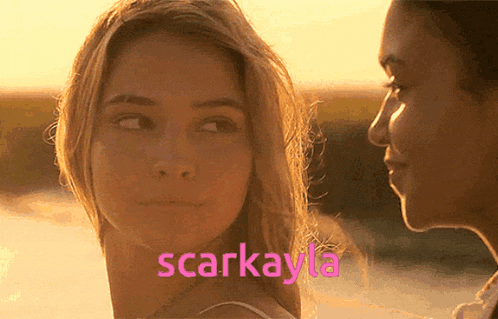 two women are looking at each other with the name scarkayla written in pink