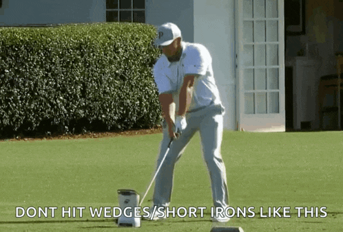 a man is swinging a golf club on a golf course and says do n't hit wedges or short irons like this .