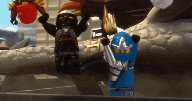 a group of lego figures are standing next to each other and one of them is holding a sword