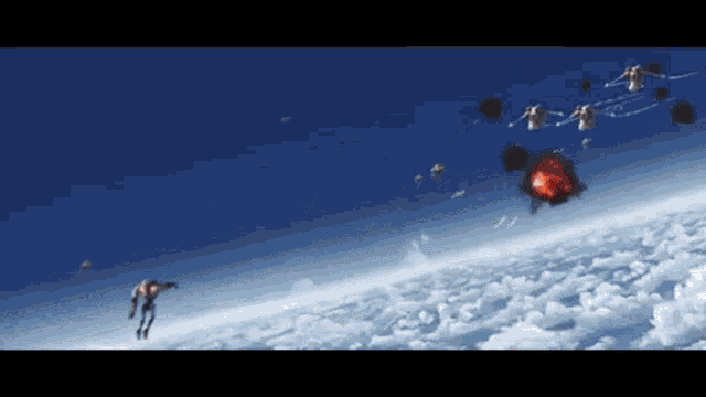 a group of people are flying through the air with a red object in the middle