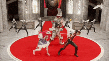 a group of people are dancing on a red carpet in a castle
