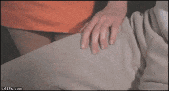 a close up of a person 's hand on a blanket with the website 4gifs.com visible