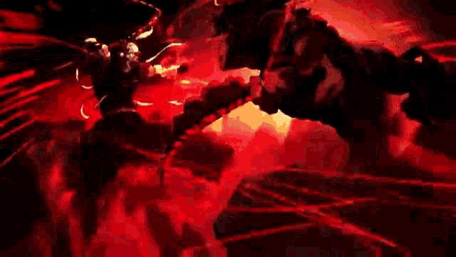 a close up of a person 's face in a dark room with a lot of fire coming out of it .
