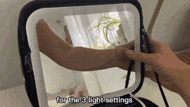 a person is adjusting a mirror with the words for the 3 light settings