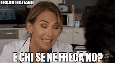 a woman in a lab coat is smiling and says trash italiano