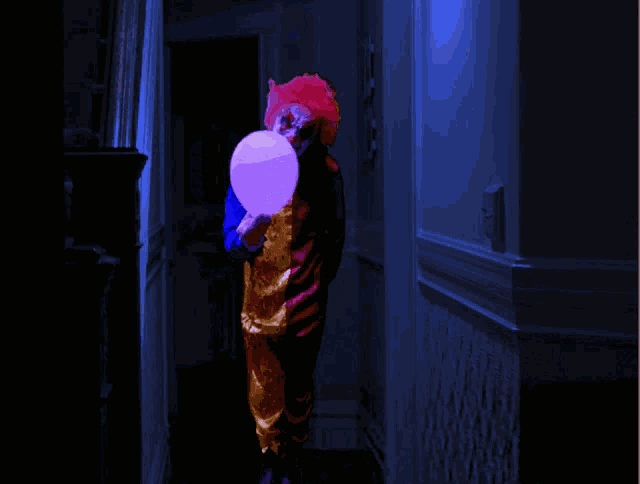 a clown in a hallway holding a purple cotton candy