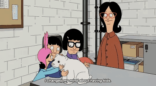 a cartoon of a woman holding a polar bear with the words i changed my mind about having kids