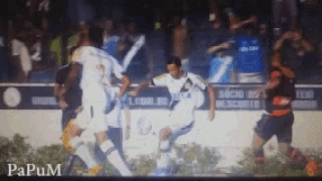 a soccer game is being played in front of a banner that says " socio de escorts "