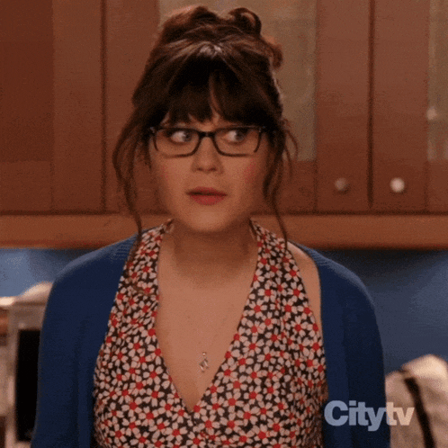 a woman wearing glasses and a blue cardigan is featured in a citytv ad