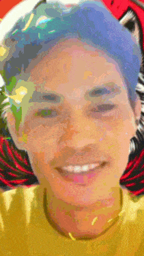 a close up of a person 's face with a yellow shirt on