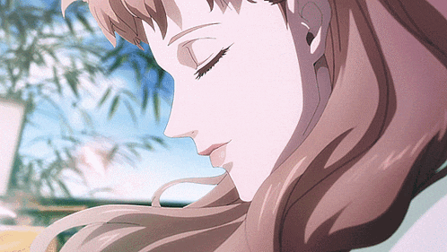 a close up of a woman 's face with closed eyes