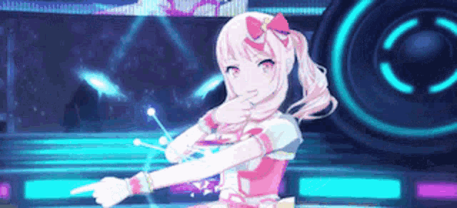 a girl is dancing on a stage in a video game and pointing at the camera .