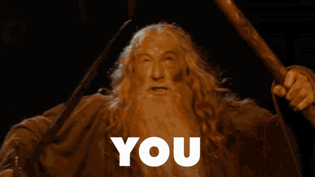 a man with long hair and a beard is holding a sword and the words shall not are above him