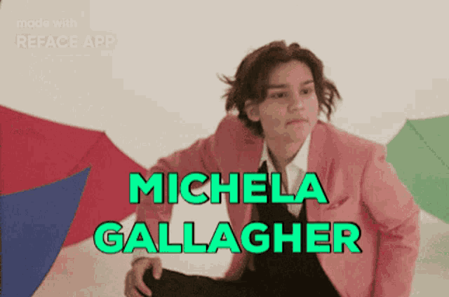 a woman in a pink jacket and tie with the name michela gallagher on it