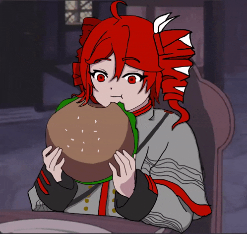 a girl with red hair is eating a large hamburger
