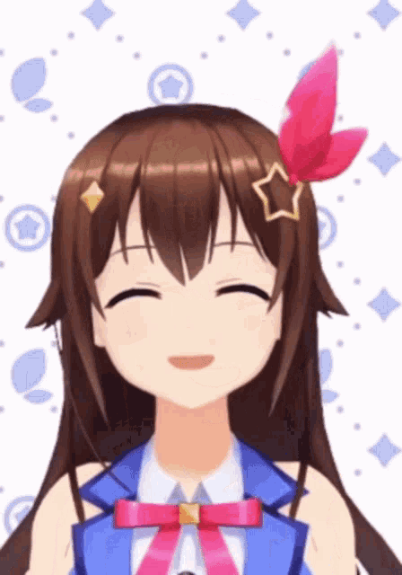 a girl with long brown hair and a star on her head smiles