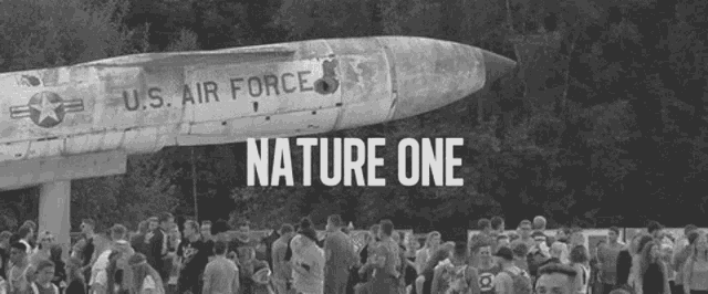 a large u.s. air force jet is surrounded by people