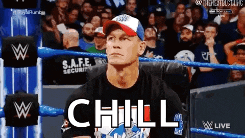a man in a baseball cap is sitting in a chair in a wrestling ring with the word chill written on his face .
