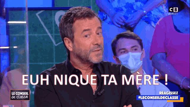 a man wearing a face mask says euh nique ta mere !