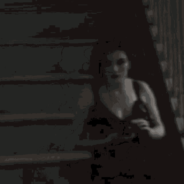 a woman is taking a picture of herself in the dark