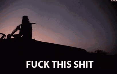 a silhouette of a person sitting on the roof of a car with the words `` fuck this shit '' written on it .