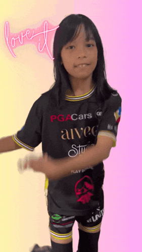 a young girl wearing a black pga cars shirt