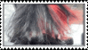 a close up of a person 's hair with a red stripe in the middle .