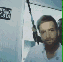 a man is holding a sword in front of a sign that says merinotista