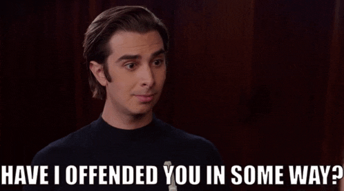 a man says " have i offended you in some way " in a dark room