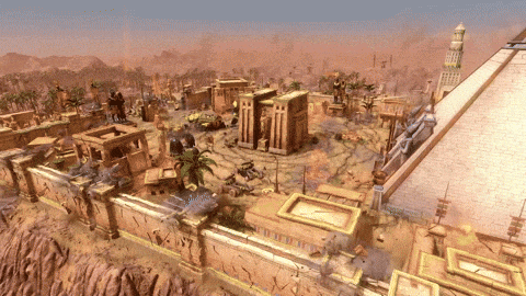 an aerial view of a desert landscape with a pyramid in the background